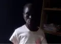 woman standing in the dark