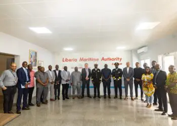 Group photo at Liberia Maritime Authority featuring APM Terminals, Svitzer, government officials, and Captains Jabbah and Lassanah