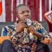 Jefferson T. Koijee former Mayor of Monrovia speaking in a microphone