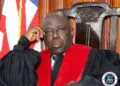 Associate Justice Yamie Quiqui Gbeisay nominated by President Joseph Boakai as Liberia’s new Chief Justice, seated in court with robe and national flag