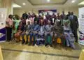 Group photo of ILO, ECOWAS officials, journalists, and partners at Abuja workshop on labor migration and decent work