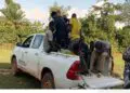 FDA patrol vehicle carrying arrested Burkinabé cocoa farmers suspected of clearing protected forestland in Grand Gedeh County