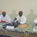 Four senior Catholic bishops of Côte d’Ivoire seated at a press conference table in Abidjan, delivering a pastoral letter on electoral reform ahead of the 2025 presidential election.