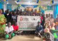 Group photo of AFELL, Clooney Foundation representatives, and West Point residents during a community outreach on drug abuse and domestic violence in Monrovia.