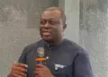 BudgIT Liberia’s outgoing Country Lead Abraham Varney speaking into a microphone during a public event in Monrovia before the organization’s leadership transition