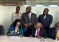 Liberian government officials and Atlas Oranto executives signing four offshore production-sharing contracts to revive Liberia’s petroleum sector at LPRA ceremony.