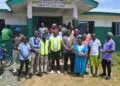 LERC Commissioners and participants gather outside the Bomi Youth Resource Center after a public hearing on LEC’s proposed electricity tariff adjustments