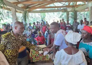 Rep. Taa Wongbe distributes community support materials to residents in Nimba District 9.