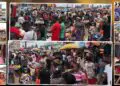 Crowded Christmas market in Monrovia with traders waiting for buyers amid slow sales