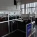 Liberia News Agency newsroom showing empty cubicles, damaged furniture, and inactive workstations, reflecting the declining operational state described by staff.