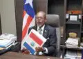 Sen. Darius Dillon holds the national budget during a press conference at his Capitol Hill office.