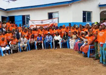 A large group of rural women and officials gather in Todee District during the LWEP engagement event led by Gender Minister Gbemie Horace Kollie