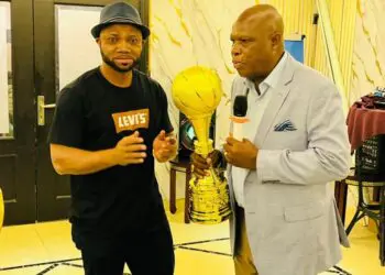 LPRC Managing Director Amos Tweh presents award to Oilers basketball team after winning the 2025 Liberia Basketball Association First Division title.