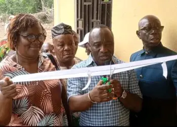 Officials cut the ribbon during the dedication of the refurbished commissioner’s residence in Foequelleh, Bong County District #4.