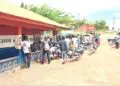 Motorcyclists gathered outside Gbarnga police station amid investigation into detainee death