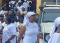 Prayer warriors escort former Chief of Protocol Nora Bondo to Criminal Court C at the Temple of Justice in Monrovia during a hearing in her corruption case.