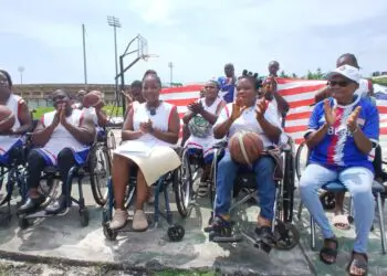 Members of Liberia’s women’s wheelchair basketball team in sports wheelchairs.