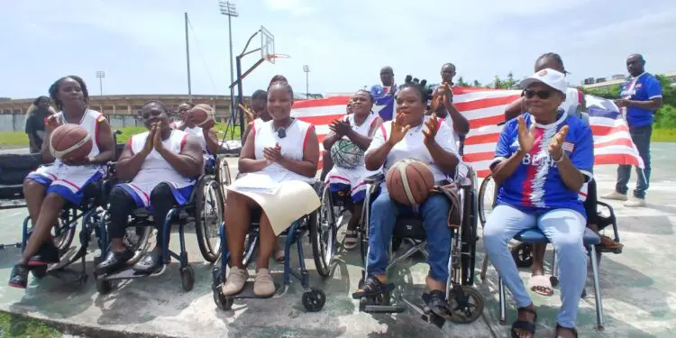 Members of Liberia’s women’s wheelchair basketball team in sports wheelchairs.