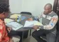 ECC Chairperson Malcolm Joseph and NIMD Country Director Oscar Bloh.