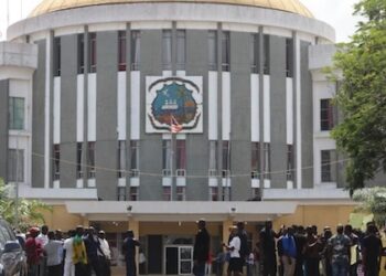 Liberians gather outside the Capitol Building in Monrovia