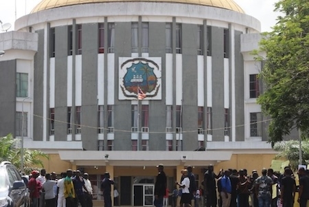 Liberians gather outside the Capitol Building in Monrovia