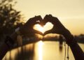 People Making Hands in Heart Shape Silhouette Sunset