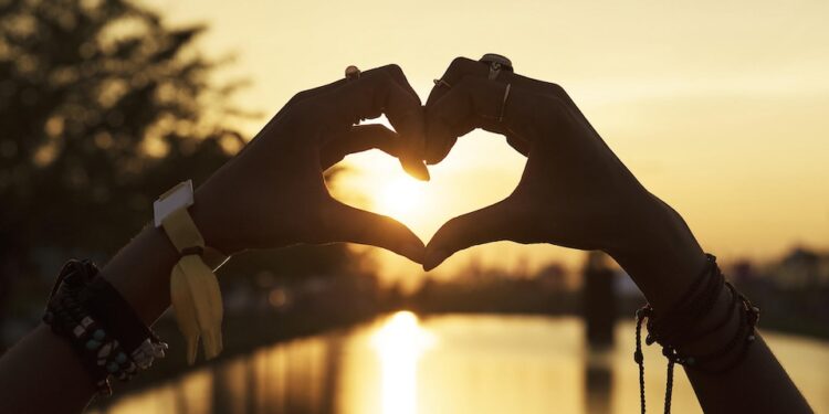 People Making Hands in Heart Shape Silhouette Sunset