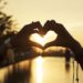 People Making Hands in Heart Shape Silhouette Sunset