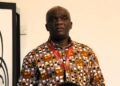 LRA Commissioner General James Dorbor Jallah speaking at a public event, wearing a printed traditional shirt and official badge, following the Senate’s confirmation of new LRA Board members