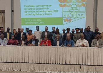 Lawmakers and other participants posed for a group photo with FAO Representative Bintia Stephen Tchicaya