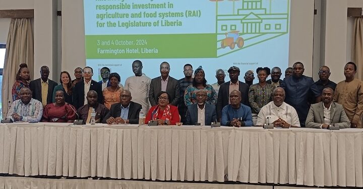 Lawmakers and other participants posed for a group photo with FAO Representative Bintia Stephen Tchicaya