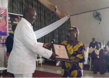 Bishop Dr. G. Laurenzo Stevens, GMI’s Founder and Vision Bearer, presenting GMI’s ‘Distinguished Christian Leadership Award’ to the representative of Bishop Dr. Kortu K. Brown