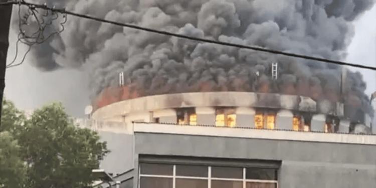 Smoke rises from the burning dome of the Capitol Building during the 2024 arson incident in Monrovia.