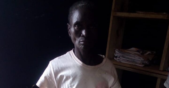 woman standing in the dark