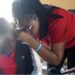 a woman testing another woman's hearing