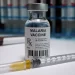 a vaccine bottle with syringe