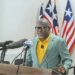 Liberia Information Minister Jerolinmek Piah speaks in Monrovia while clarifying the U.S. visa suspension for Liberians