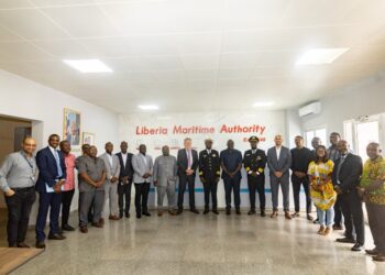 Group photo at Liberia Maritime Authority featuring APM Terminals, Svitzer, government officials, and Captains Jabbah and Lassanah