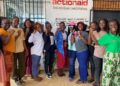 ActionAid Liberia Country Director, Madam Lakshmi Subramani (right), poses with members of the Young Feminist Movement during a menstrual health campaign in Monrovia.