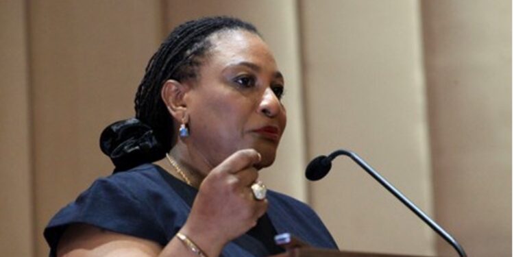 Ambassador Josephine Nkrumah speaks at a podium during an ECOWAS event in Monrovia, supporting Liberia’s bid to host key regional institutions