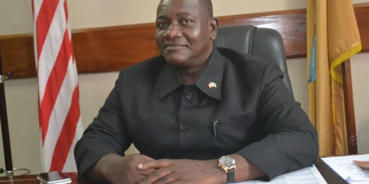 Former Senate Pro Tempore Armah Zolu Jallah sitting at his office desk