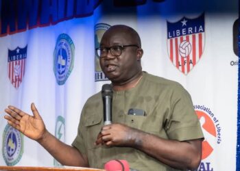 LMHRA Managing Director Dr. Luke L. Bawo speaks at the SWAL awards ceremony, urging sports writers to join the fight against substandard and falsified medicines in Liberia.