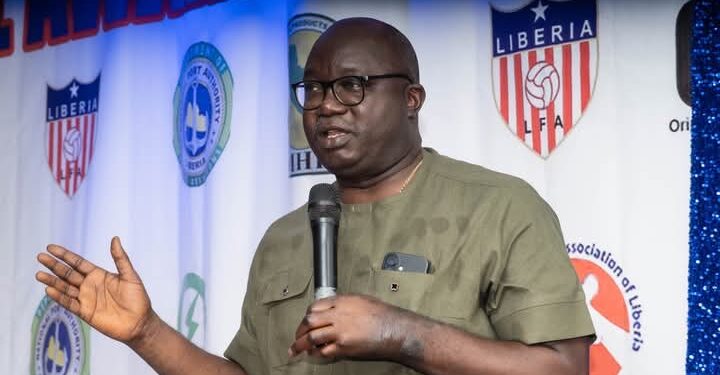 LMHRA Managing Director Dr. Luke L. Bawo speaks at the SWAL awards ceremony, urging sports writers to join the fight against substandard and falsified medicines in Liberia.