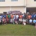 Group photo of 47 Gbarnga schoolgirls, American youth missionaries, and organizers during a workshop by Kathy Justice Girls Educational Liberia on teen pregnancy and drug abuse prevention.