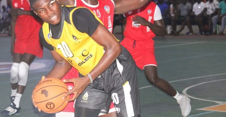 LPRC Oilers player in action against Mighty Barrolle in LBA First Division matchup