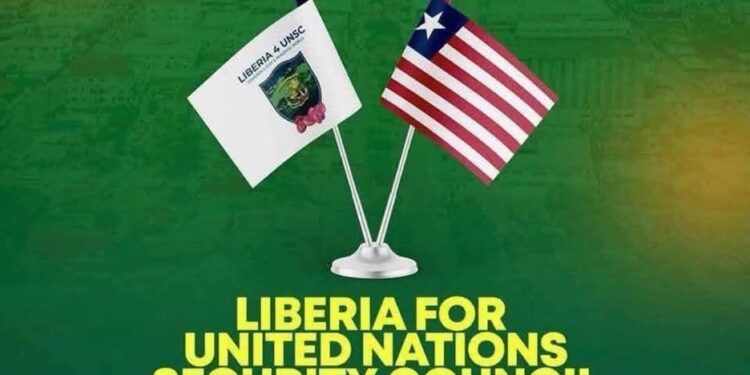 Campaign banner showing Liberia’s flag and the UN Security Council flag side-by-side, promoting the country’s 2026–2027 UNSC bid with the slogan “Towards a Just and Peaceful World.”