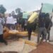 Students at the Lutheran University of Liberia protest by blocking an entrance with worn-out mattresses and holding handwritten signs, demanding better dormitory conditions and academic services.