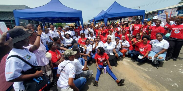 Women sitting on floor in bid to end stigma against menstrual hygiene