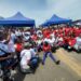 Women sitting on floor in bid to end stigma against menstrual hygiene