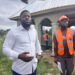 Rep. Moima Briggs Mensah’s Chief of Office Staff, Murfee Anderson, defends a legislative development project in Salala, Bong County, during a site visit with contractors and staff.